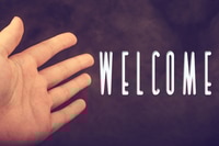 Preview: Welcome Invitation with Outstretched Hand on Soft Background