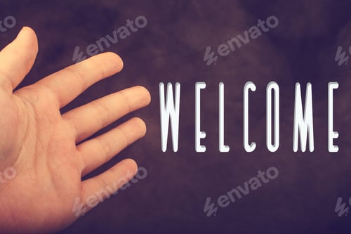 Preview: Hand Making A Welcome Gesture On A Dark Background