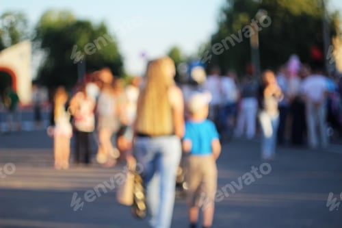 Preview: Blurred Mother And A Son From Behind On A City Festival