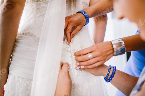 Preview: Bride Preparing For Her Wedding, Putting On The Garter And Lingerie