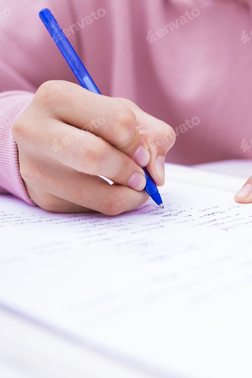 Preview: Child'S Hand Writing On The Home Desk Or School