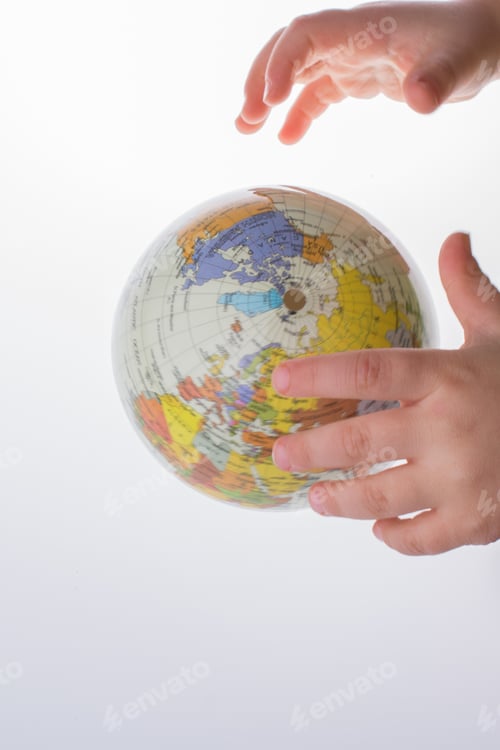 Preview: Child Holding A Globe In On A White Background