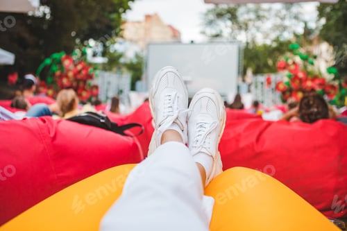 Preview: People At City Public Park Watching Movie At Open Air Cinema