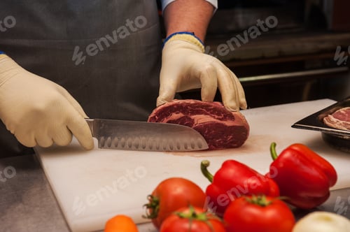 Preview: Chef Cutting Meat With Knife