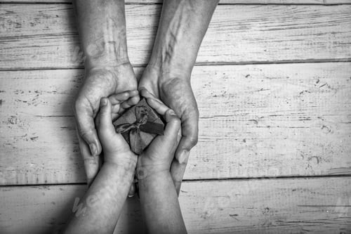 Preview: Mother Day Celebration With Parent Woman Holds Young Kid'S Hands Supporting Gift Box, Donation For