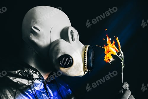 Preview: Man In The Gas Mask Holding Flower On Fire. Radiation Influence. Environmental Pollution. Chernobyl