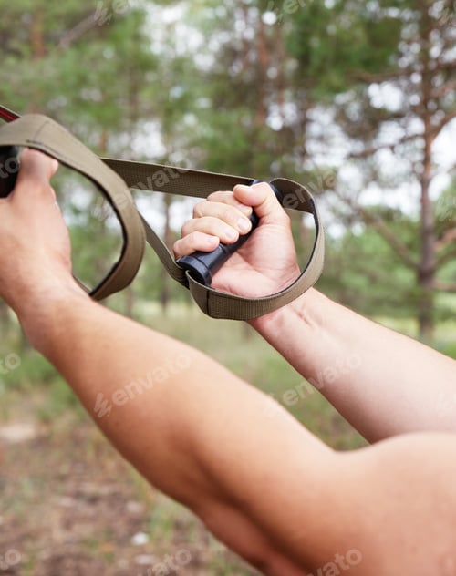 Preview: Athlete Does Sports Strength Exercises On Belts, Outdoor Fitness, Close Up