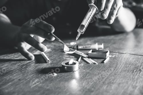 Preview: Man Preparing Heroin On Fire. Needle Syringe. Drugs Addict. Candle Burning With Matches And