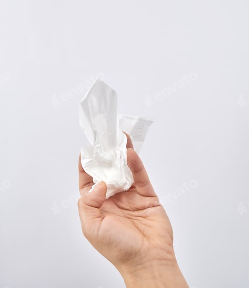 Preview: Female Hand Holding A Clean White Paper Napkin For Face And Body, White Background, Copy Space