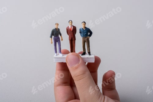 Preview: Tiny Figurines Of Men Miniature Model In Hand
