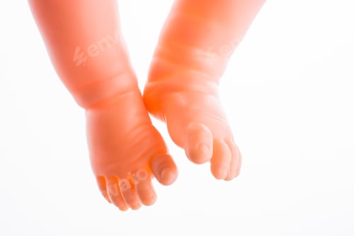 Preview: Baby Doll'S Legs On A White Background
