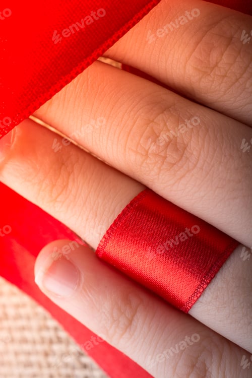Preview: Red String Tied Around Ring Finger Of The Hand