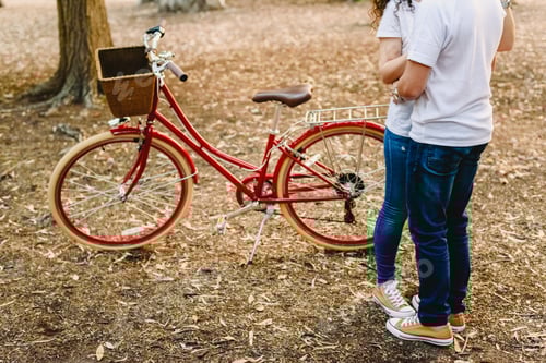 Preview: Couple Of Lovers With Green Sneakers And Jeans Standing Next To A Vintage Bicycle