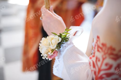 Preview: Woman With Flowers On Hand Holding Candle At Church