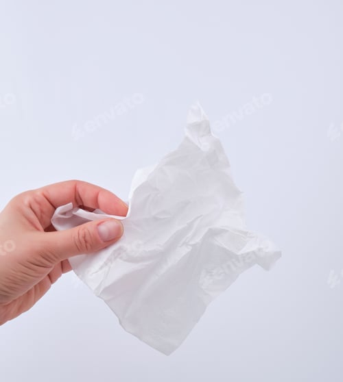 Vista previa: Female Hand Holding A Clean White Paper Napkin For Face And Body, White Background