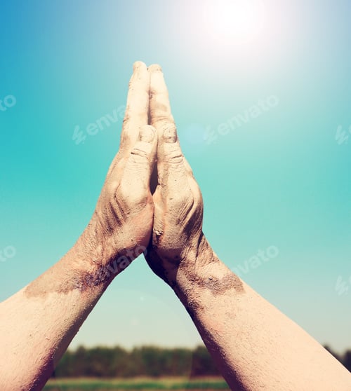 Preview: Two Male Hands Stacked Together Against The Sky