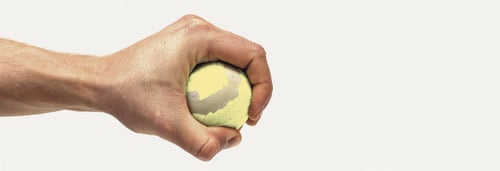 Preview: Male Hand Holding Tennis Ball Isolated On White Background. Minimalistic Concept.