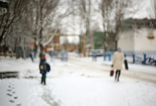 Preview: Blurred Snowy Urban Background With People