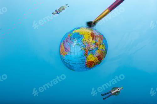 Preview: Brush And Little Globe With Floating Figurines Around In Water