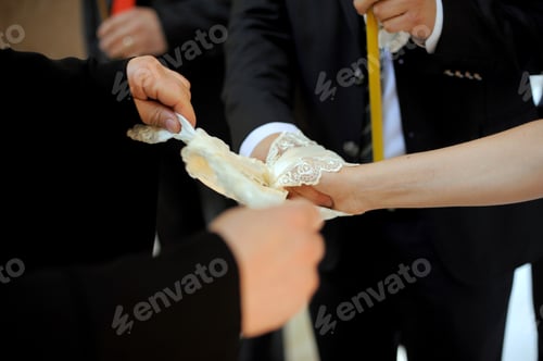 Preview: Bride And Groom Holding Hands During Church Wedding Ceremony