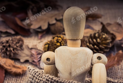 Preview: Wooden Dolls Posing Amid Autumn Background