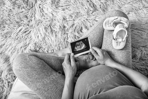 Preview: Pensive Pregnant Woman Dreaming About Child. Pregnant Woman Enjoying Future Motherhood With First