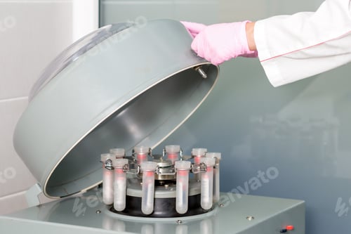 Preview: Doctor'S Hand Opening Or Closing Centrifuge Machine With Test Tubes In The Lab.