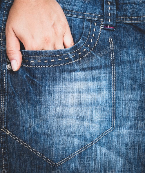 Preview: Left Hand Stuck In The Front Pocket Of Blue Jeans, Full Frame, Close Up