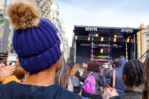 Preview: Young Black Woman Enjoying Listening To A Live Concert With Headphones On Her Back.