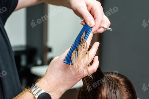 Preview: Close Up Hairdresser Cutting Hair Of Woman In Beauty Salon.