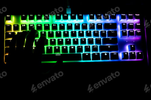 Preview: Hand Silhouette On Illuminated Computer Keyboard