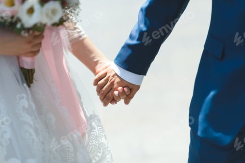 Preview: Bride And Groom Holding Hands Walking At Sunny Park