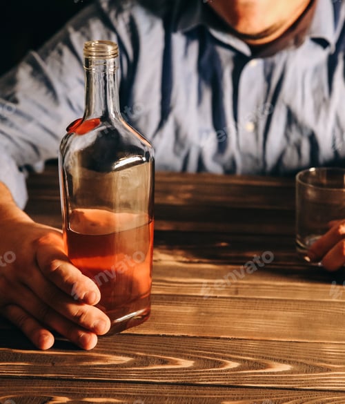Preview: Alcoholic Addict. Man Holding With Alcohol And A Glass. Dangerous Habit. Unhealthy Life Concept