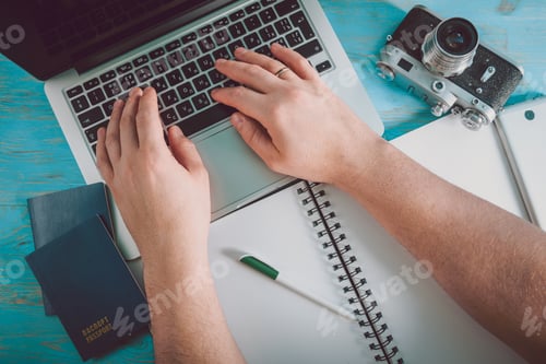 Preview: Working On Laptop At Blue Wooden Desctop