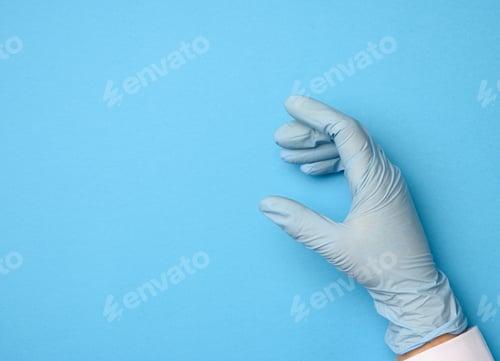 Preview: Gloved Hand on Blue Surface