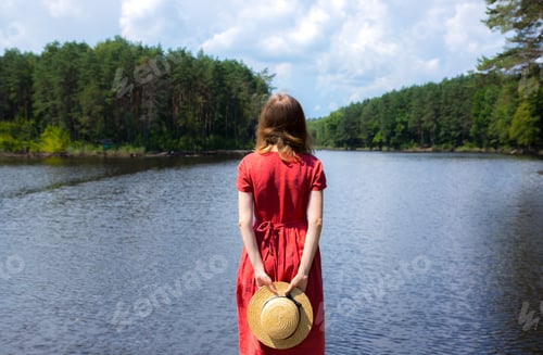 Preview: Beautiful Girl With A Straw Hat Near The Lake. Amazing Summer Nature. Travel Concept. Inspiration
