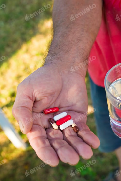 Preview: Senior Hand With Pills And Medications
