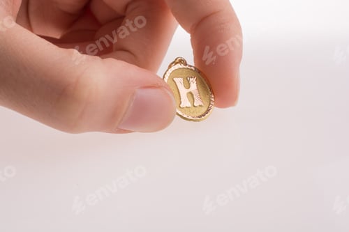 Preview: Golden Letter H On A White Background