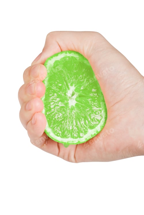 Preview: Fresh Squeezed Green Lime With Hand Isolated On A White Background