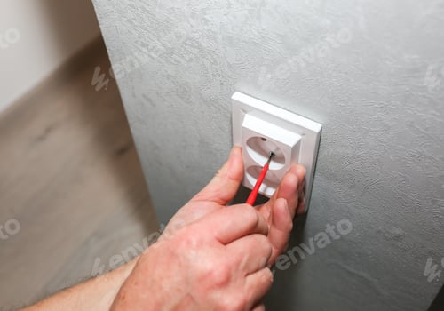 Preview: Man Is Installing The Socket. Electricity Maintenance Repair Works In The Flat. Restoration Indoors.