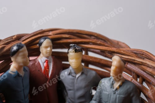 Preview: Miniature Figures Inside Brown Weaved Basket Close Up