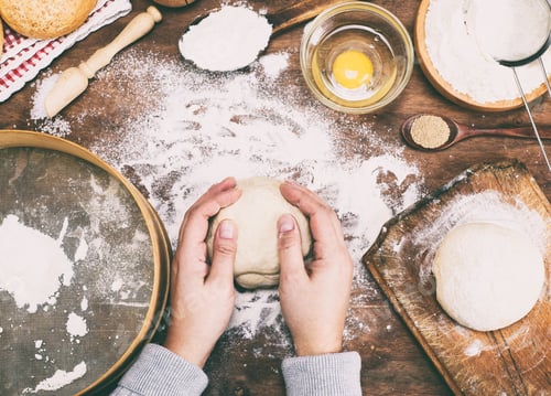 Preview: Women'S Hands Hold A Ball Of Yeast Dough On A Table In The Middle Of The Ingredients For Bread