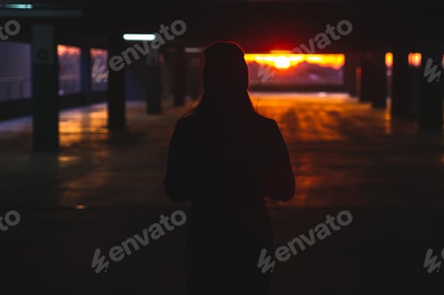 Preview: Woman Stand At Car Parking Look On Orange Sunset