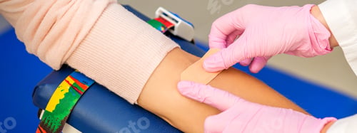 Preview: Close Up Of Nurse Hand Applying Adhesive Plaster On Arm Of Patient After Blood Collection In The