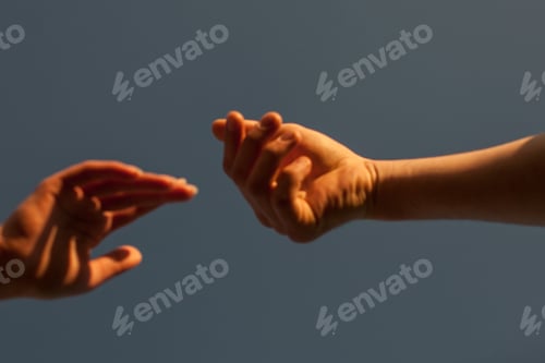 Preview: Couple Of Hands Against The Sky View