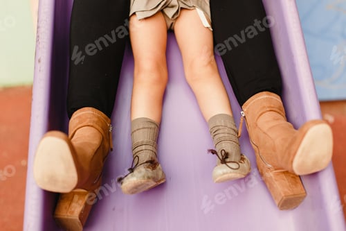 Preview: Feet Of Children Playing Climbing And Jumping Down Slides