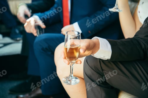 Preview: Hand Hold Bottle Of Champagne And Filling Up Glasses Concept