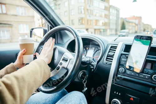 Preview: Woman Hand Close Up Driving. Stuck In Traffic. Navigation On The Phone