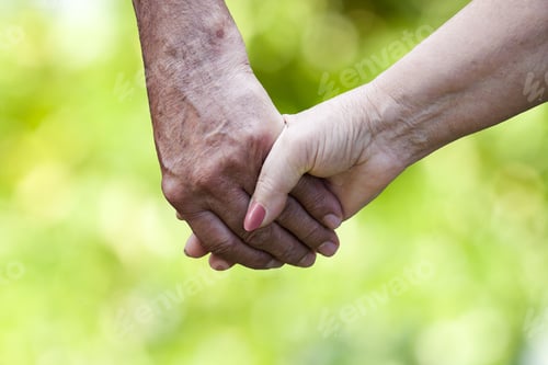 Preview: Clasped Hands Of Older People With Natural Background