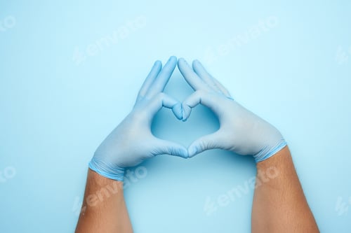 Preview: Hands in Gloves Forming Heart Shape
